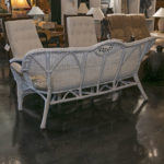 White Vinyl Outdoor Wicker Style Sofa With Tropical Print Seat Cushions - Image 3