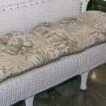 White Vinyl Outdoor Wicker Style Sofa With Tropical Print Seat Cushions - Image 4