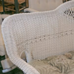 White Vinyl Outdoor Wicker Style Sofa With Tropical Print Seat Cushions - Image 5