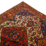 5’4” x 6’9” Hand Knotted Persian Wool Rug in Red