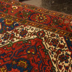 5’4” x 6’9” Hand Knotted Persian Wool Rug in Red - Image 4