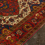 5’4” x 6’9” Hand Knotted Persian Wool Rug in Red - Image 6