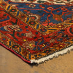 5’4” x 6’9” Hand Knotted Persian Wool Rug in Red - Image 7