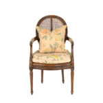 French Louis XVI Style Cane Back Armchair with Floral Upholstery