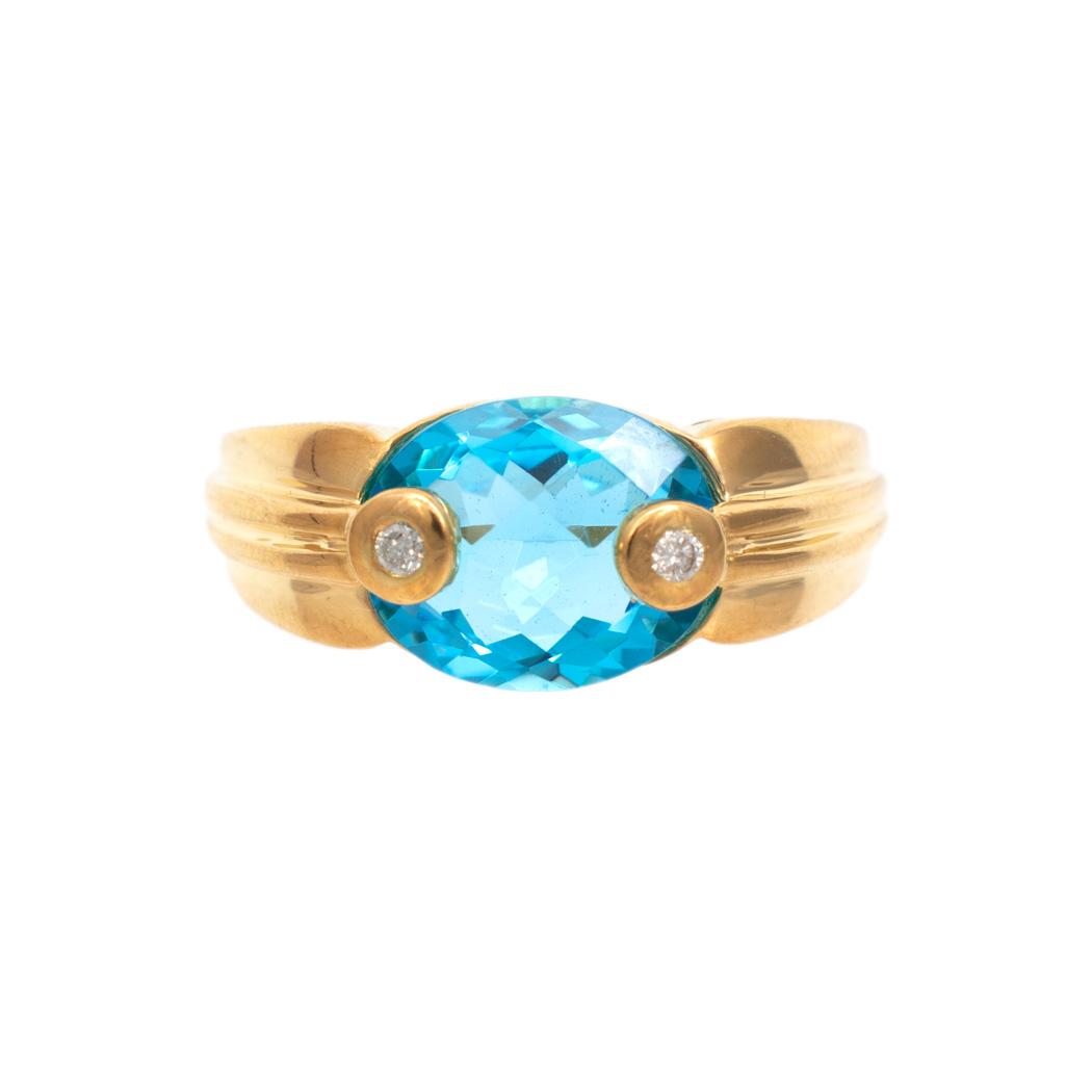 RJ_ML1365-3 6 Carat Blue Topaz Ring with Diamond Accents in 18 Karat Gold - Image 1