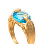 6 Carat Blue Topaz Ring with Diamond Accents in 18 Karat Gold - Image 2